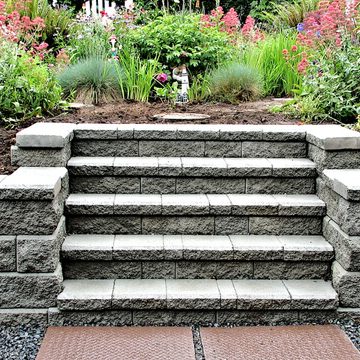 Stone retaining wall steps with planted landscaping